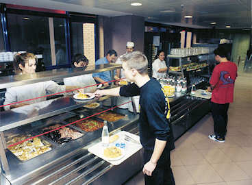 Excessive energy waste and solid waste are typical of the old-style company cafeteria