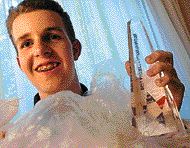 High schooler Daniel Burd with some of his science project